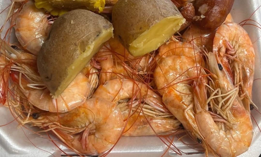 SO90 DAQS & SACKS: a tray of boiled shrimp with corn, potato and sausage
